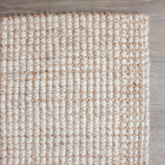 For a more sumptuous feel under foot these Wool and Jute hand-woven floor rugs are hard to beat. Our combination of the heavy weave and the soft appearance of pure wool make a wonderful, luxurious, exotic-looking floor rug suitable for any area in the home. Colour: Natural  Made in India. Available in 6 sizes.