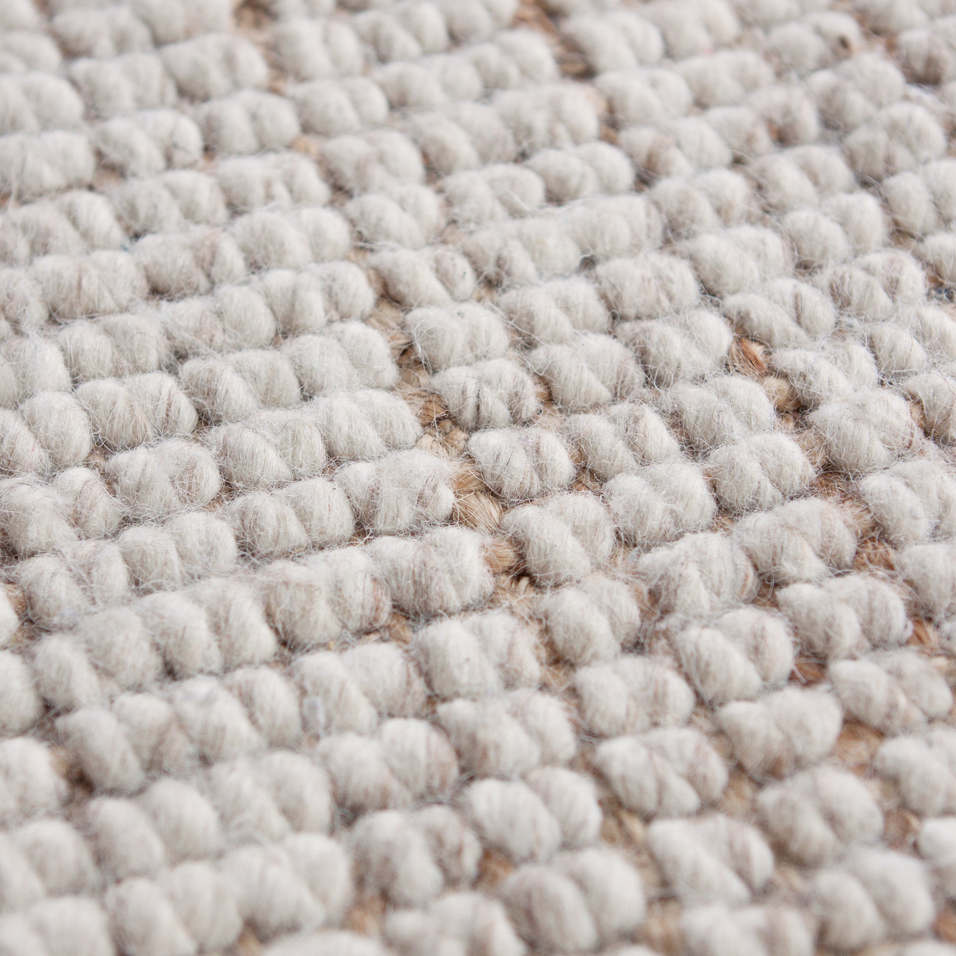 For a more sumptuous feel under foot these Wool and Jute hand-woven floor rugs are hard to beat. Our combination of the heavy weave and the soft appearance of pure wool make a wonderful, luxurious, exotic-looking floor rug suitable for any area in the home. Colour: Natural  Made in India. Available in 6 sizes.